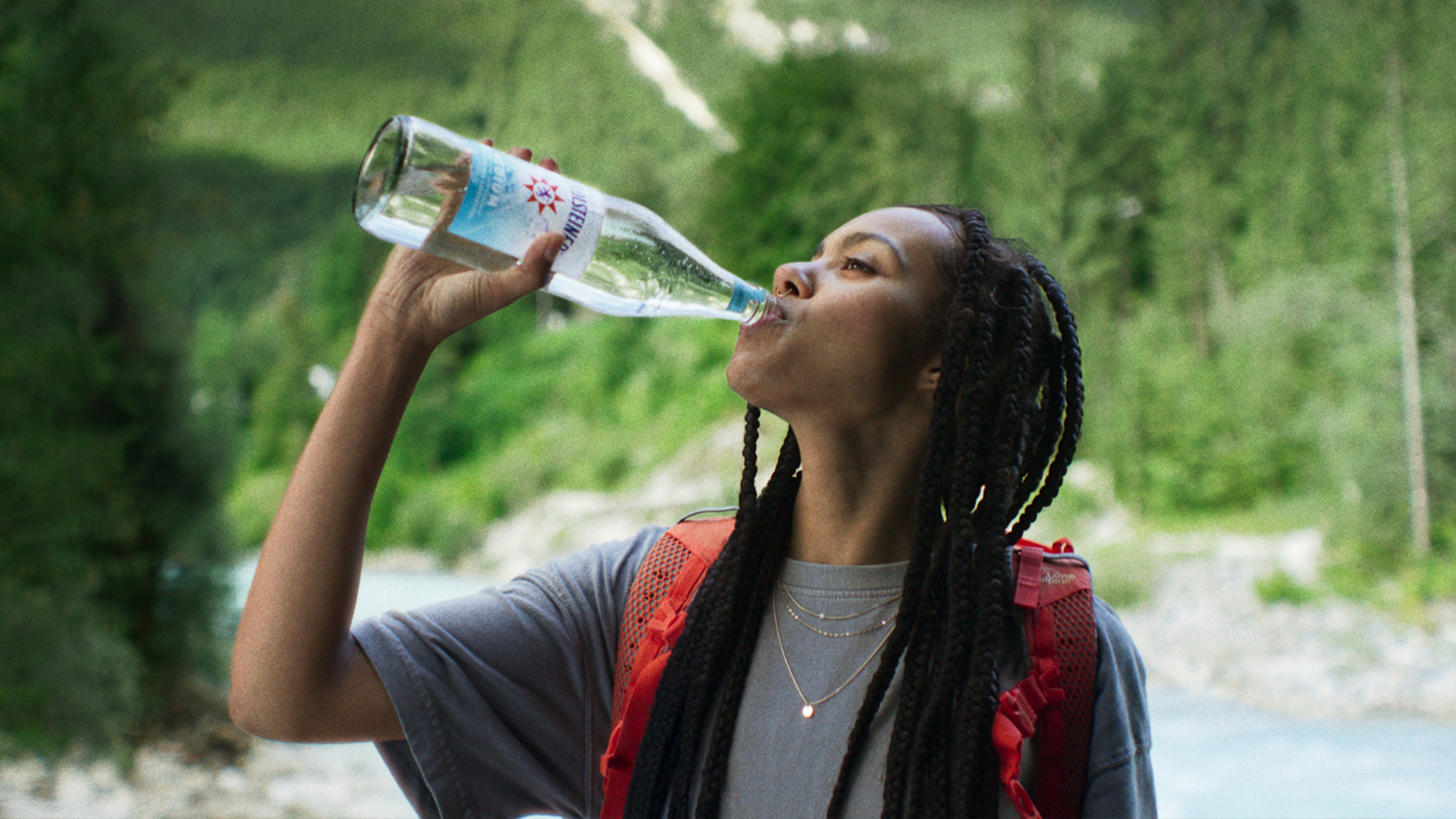 A key visual from the Bring back the power campaign, showing a woman drinking Gerolsteiner Medium from a 0.75l glass bottle